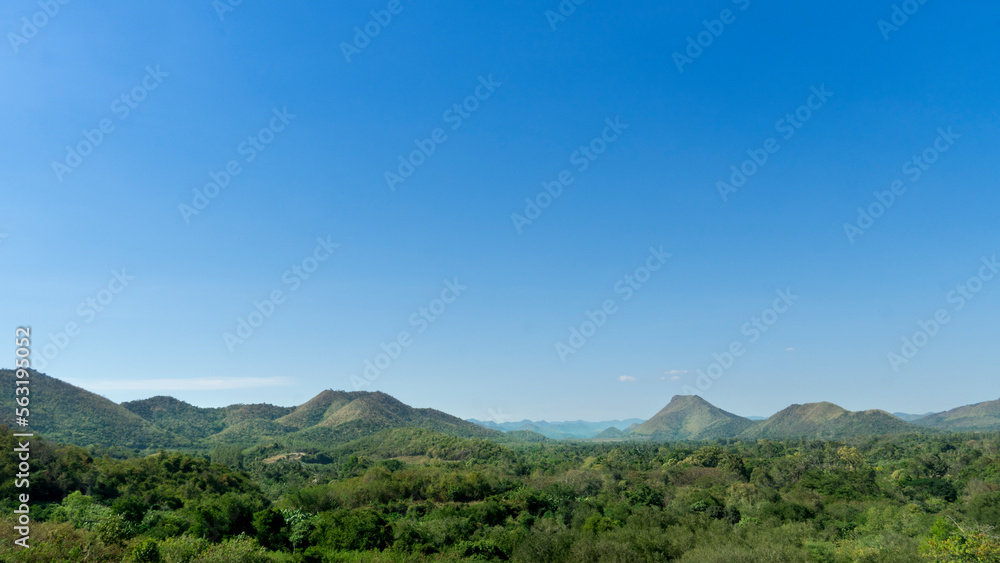 Landscape view nature of green forest and mountain. Under the blue sky. At Kaeng Krachan District of Thailand.