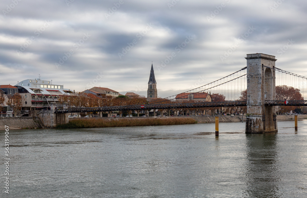 Fototapeta premium Bridge over the Rhone River in a small town, Tournon-sur-Rhone, France.
