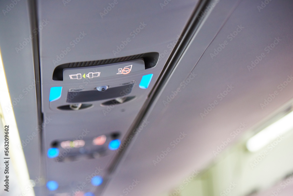 close up of no smoking and belt sign on plane close up of no smoking and belt sign on plane