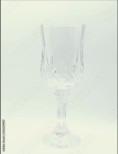 empty, rotating glass on a white background
