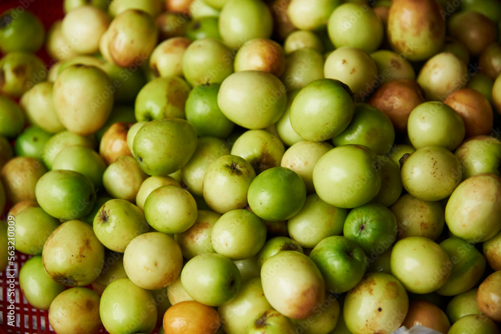 top view of a pile of fresh, delicious, green monkey apples for sell in the market
