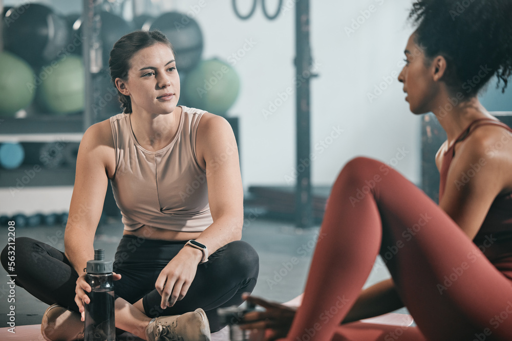 Relax, friends or women at gym talking about fitness training goals, workout progress or exercise on a break. Resting, sports girl and healthy black woman in conversation, discussion or speaking Relax, friends or women at gym talking about fitness training goals, workout progress or exercise on a break. Resting, sports girl and healthy black woman in conversation, discussion or speaking