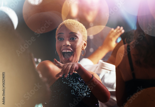 Dance, night and disco with black woman at party for club, celebration and energy. Concert, music and rave with girl dancing in crowd for new year, freedom and entertainment at dj festival event