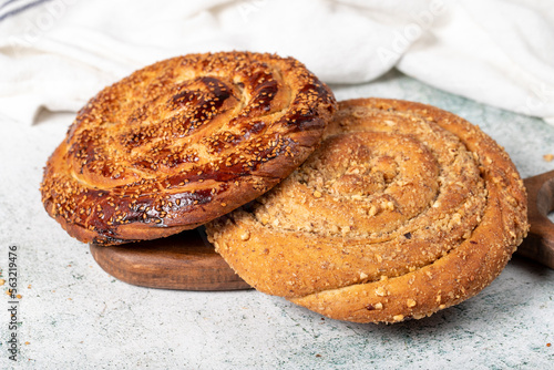 Poppy bread. Bread prepared with poppy on stone background. close up photo