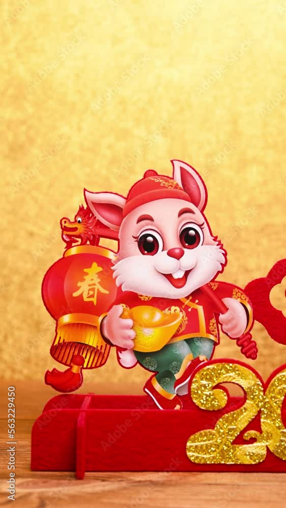 pan view Chinese New Year of Rabbit mascot paper cut on golden background at vertical composition the Chinese words means fortune and springtime no logo no trademark pan view Chinese New Year of Rabbit mascot paper cut on golden background at vertical composition the Chinese words means fortune and springtime no logo no trademark