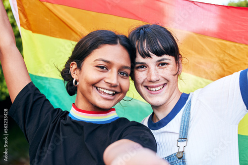 Bild auf Leinwand Portrait, lesbian and couple with flag for pride, freedom and happy or bonding at festival