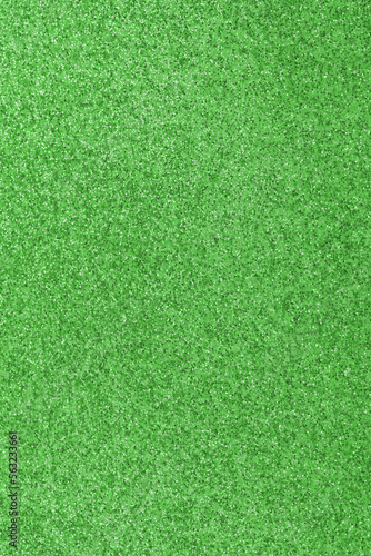 GREEN shimmering glitter material background with glowing effects