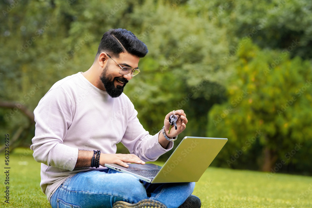 young indian man using laptop and giving expression like talking on video call. young indian man using laptop and giving expression like talking on video call.