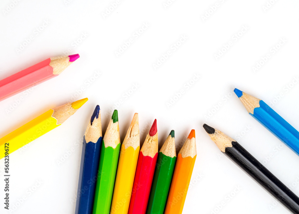 Fototapeta premium Colored pencils on white background. Stationery