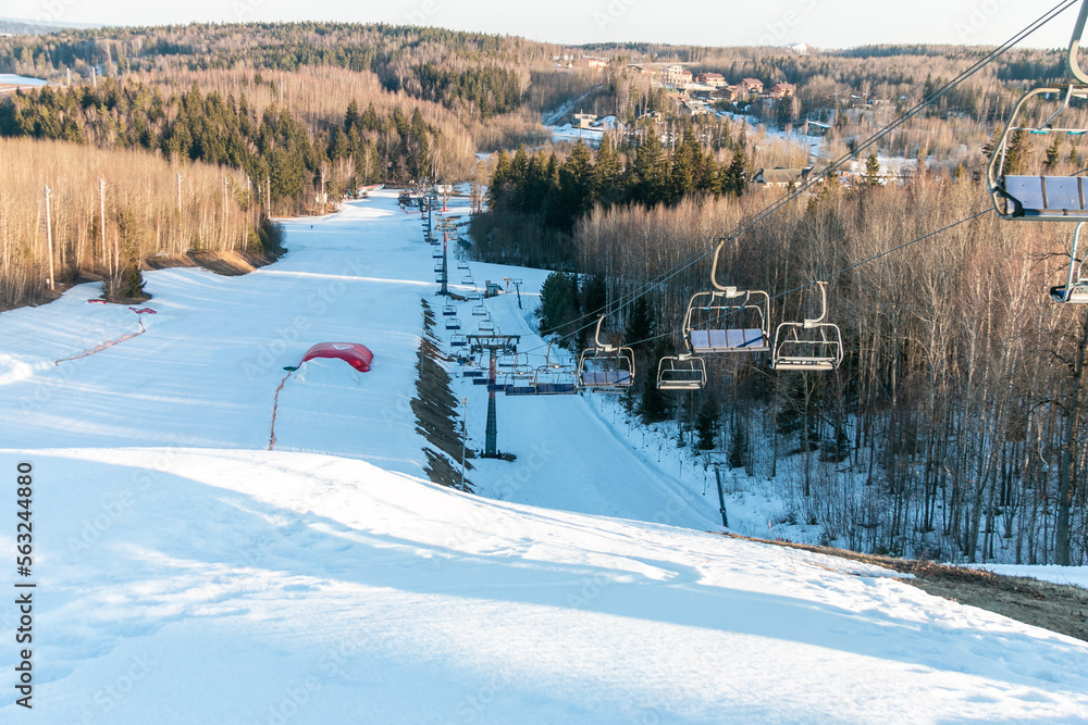 Chair lift to lift snowboarders and skiers uphill. Winter extreme sport. Ski resort. Winter sports concept.
