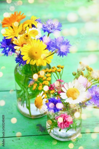 Beautiful bouquet of wildflowers with magic bokeh light -  greeting card 