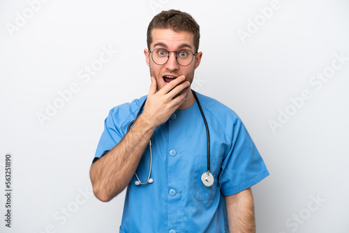 Young surgeon doctor caucasian man isolated on white background surprised and shocked while looking right