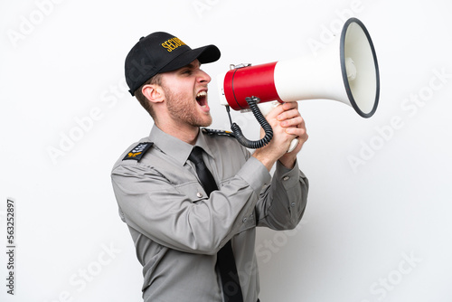 Young safeguard caucasian man isolated on white background shouting through a megaphone