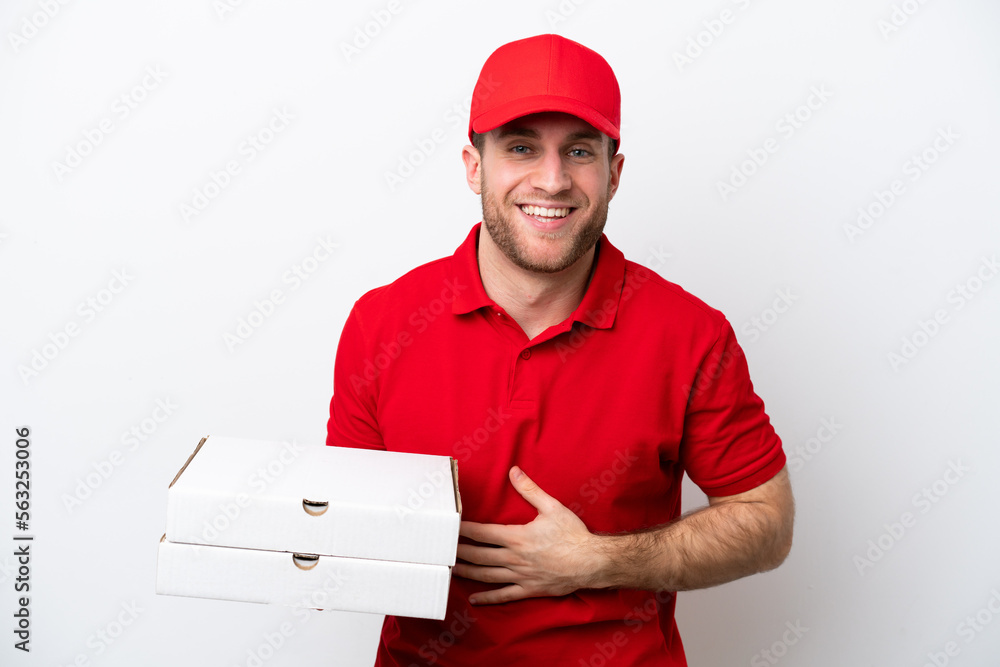 Pizza delivery caucasian man with work uniform picking up pizza boxes isolated on white background smiling a lot Pizza delivery caucasian man with work uniform picking up pizza boxes isolated on white background smiling a lot
