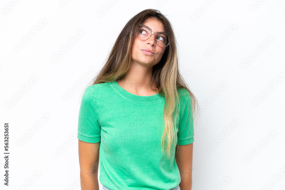 Young caucasian woman isolated on white background and looking up Young caucasian woman isolated on white background and looking up