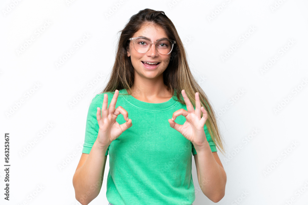 Young caucasian woman isolated on white background showing ok sign with two hands Young caucasian woman isolated on white background showing ok sign with two hands