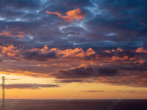 Sunset over Tasman sea at Piha beach, Auckland, New Zealand