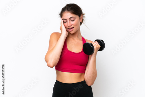 Young sport caucasian woman making weightlifting isolated on white background with headache