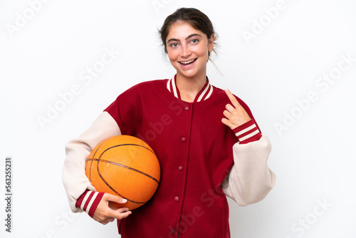 Young basketball player woman isolated on white background giving a thumbs up gesture © luismolinero