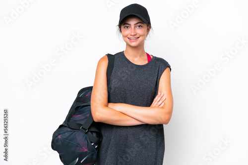 Young sport woman with sport bag isolated on white background keeping the arms crossed in frontal position