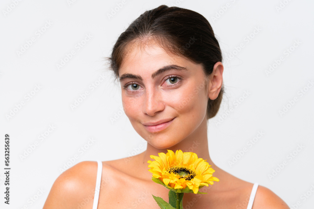 Young Pretty caucasian woman isolated on white background holding a sunflower. Close up portrait Young Pretty caucasian woman isolated on white background holding a sunflower. Close up portrait