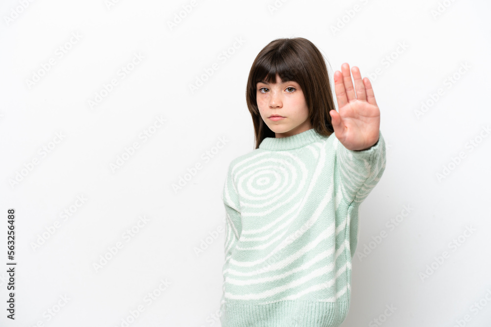 Little caucasian girl isolated on white background making stop gesture Little caucasian girl isolated on white background making stop gesture