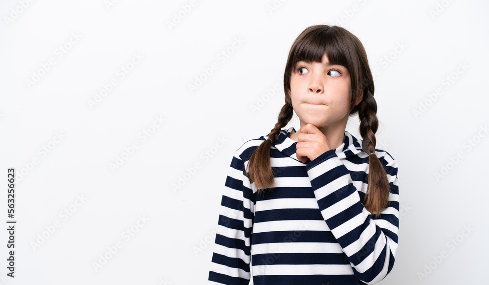 Little caucasian girl isolated on white background having doubts and thinking Little caucasian girl isolated on white background having doubts and thinking