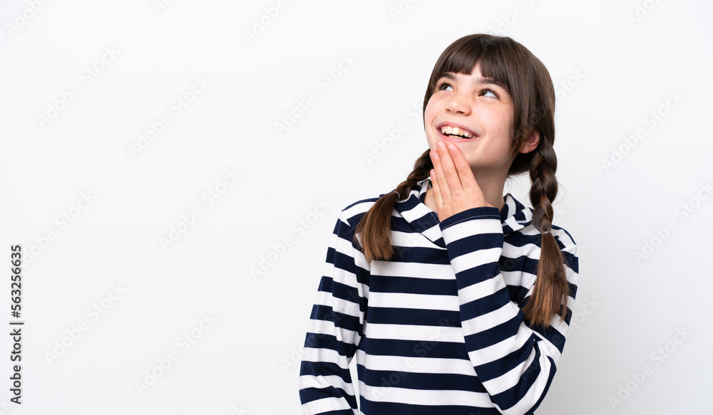 Little caucasian girl isolated on white background looking up while smiling Little caucasian girl isolated on white background looking up while smiling