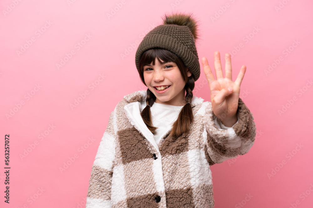 Little caucasian girl with winter jacket isolated on pink background happy and counting four with fingers Little caucasian girl with winter jacket isolated on pink background happy and counting four with fingers