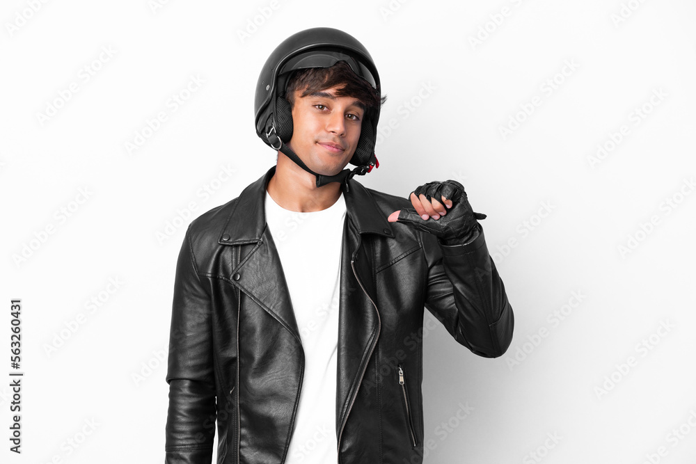 Young man with a motorcycle helmet isolated on white background proud and self-satisfied Young man with a motorcycle helmet isolated on white background proud and self-satisfied
