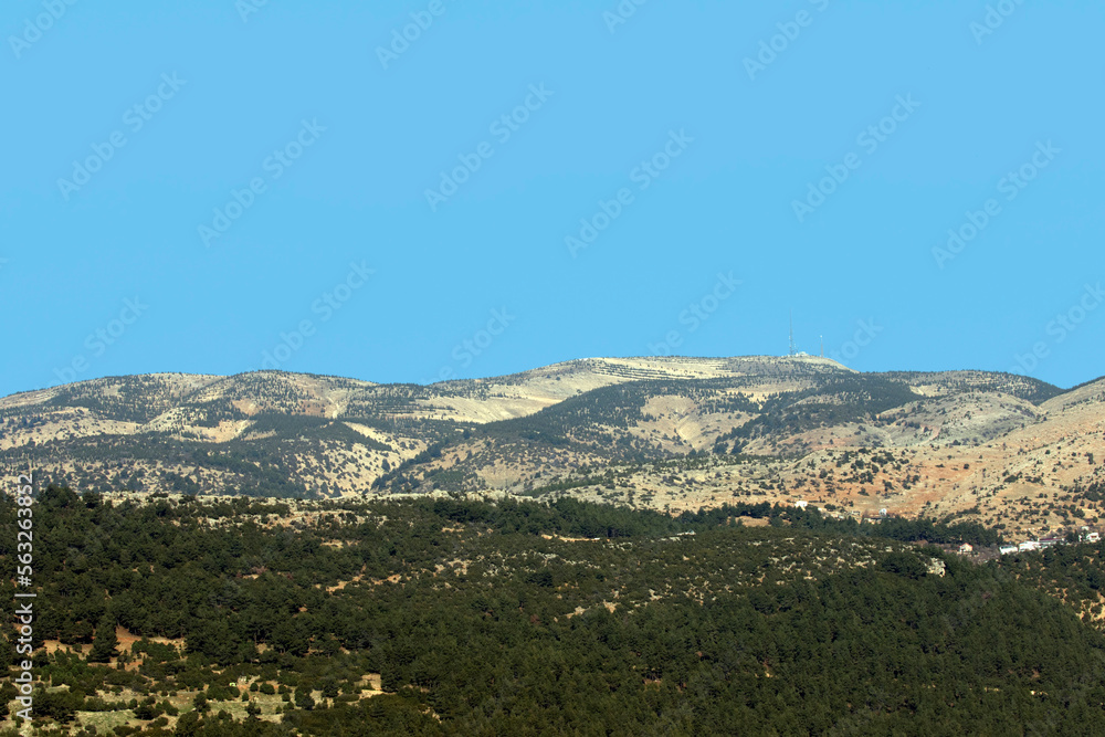 A far view of the peak of Ahir Mountain in Kahramanmaras province, Turkey in afternoon in a sunny winter day