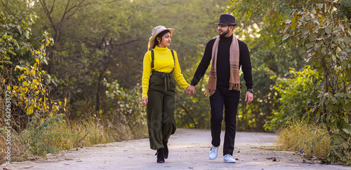 Pre wedding shot of an Indian couple in Nature's trail in Delhi, India. Romantic couple Shoot. Bride and groom in the natural forest of with trees. Mountain wedding Forest wedding Wedding photo shoot.