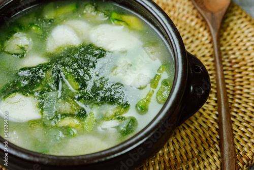 Tteokguk, Korean Seaweed fulvescens Sliced Rice Cake Soup : Oval-shaped rice cake cooked in broth. A traditional Lunar New Year dish. Clear beef broth is most commonly used, but chicken or seafood may photo