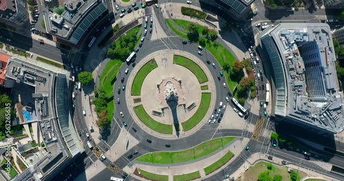 Top view of the city center of Lisbon Portugal, cars move in a circular motion through the streets of the city. European city on the ocean