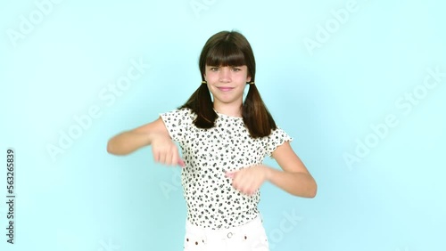 Little girl  making good-bad sign over isolated background