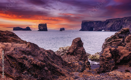 Majestic large arch of lava on the coast in Atlantic Ocean during sunset. Amazing Icelandic scenery. one most Popular Travel destinations in Iceland. Sudurland, cape Dyrholaey, Iceland, Vik, Europe