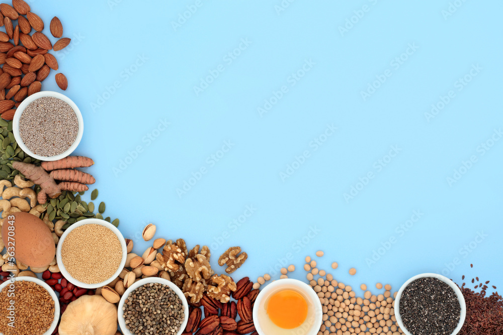 Food collection high in essential fatty acids. Healthy foods with ingredients high in lipids containing unsaturated good fats with nuts, dairy, seeds, legumes and grain. On blue. Food collection high in essential fatty acids. Healthy foods with ingredients high in lipids containing unsaturated good fats with nuts, dairy, seeds, legumes and grain. On blue.