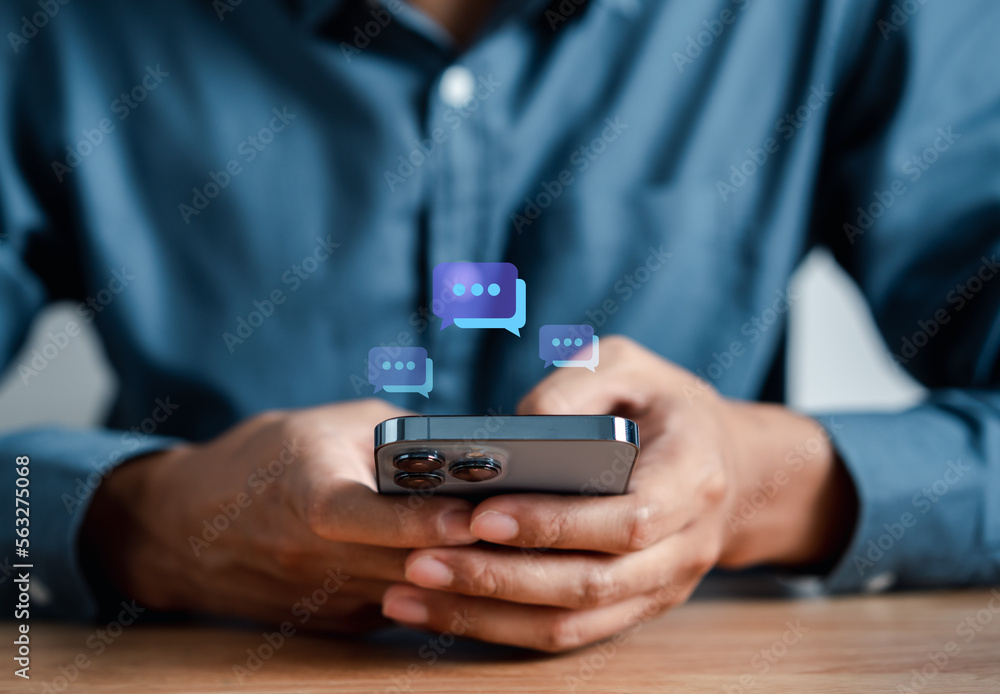 Businessman using smartphone chatting to send message to communication and social network connection online technology concept. Businessman using smartphone chatting to send message to communication and social network connection online technology concept.
