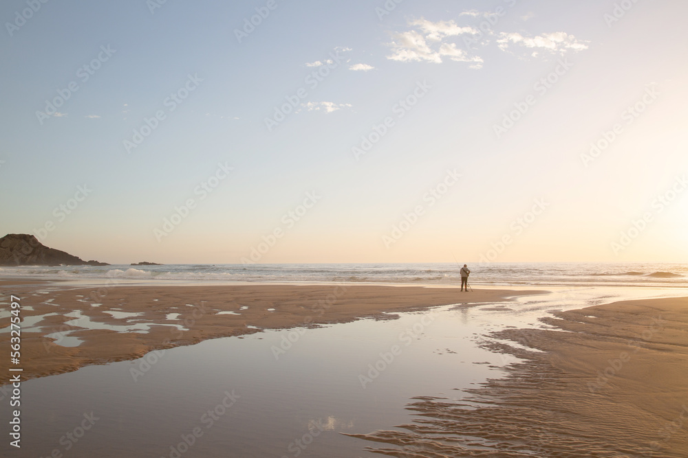 Fishing at Twilight on Odeceixe Beach; Algarve; Portugal