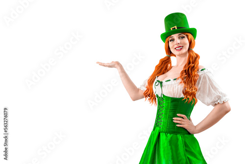 Young red-haired woman in a green Leprechaun elf costume during a St. Patrick's Day party. Happy Irish girl showing thumb up. Ireland National Independence Day March 17th