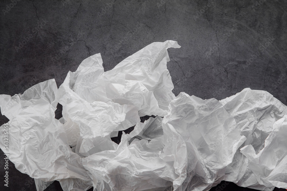 Airy white paper on a black background. Backgrounds and textures Airy white paper on a black background. Backgrounds and textures