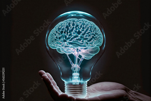 Hand holding a Lightning human brain inside a light bulb. Brainstorming concept