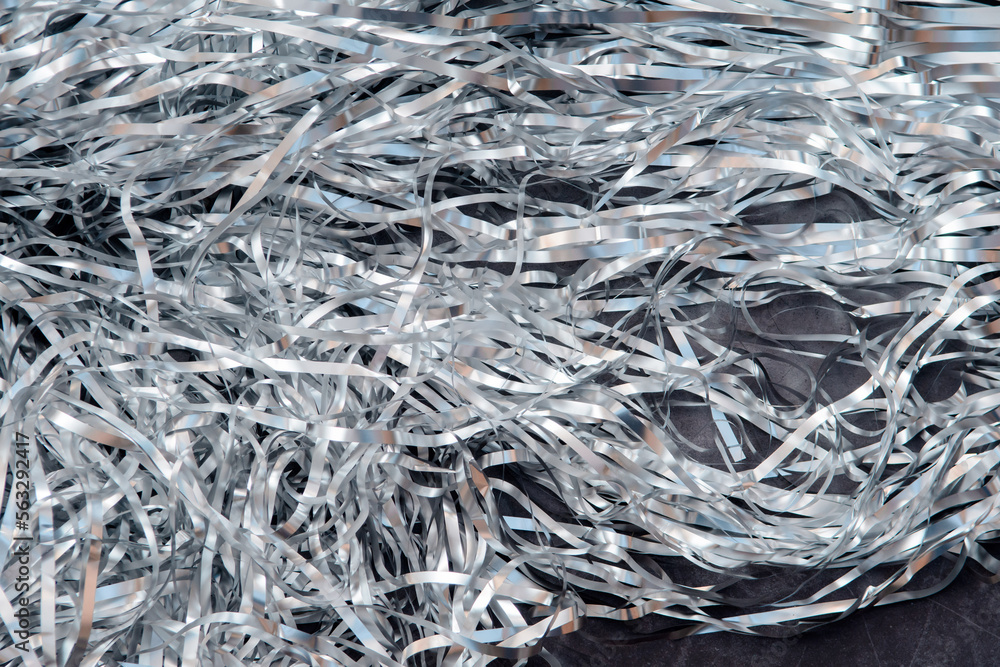 Silver Christmas tinsel background, abstract and holiday texture background. Silver Christmas tinsel background, abstract and holiday texture background.