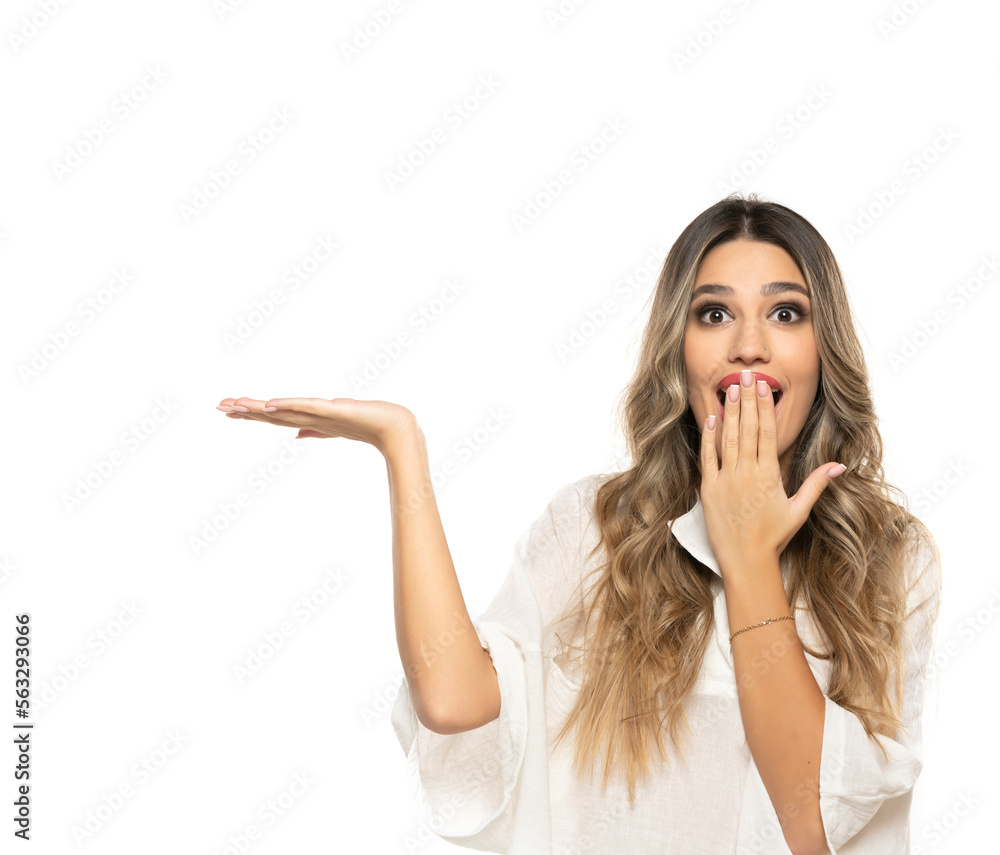 portrait of a young happy woman with long wavy hair nad makeup advertise some product on a white background portrait of a young happy woman with long wavy hair nad makeup advertise some product on a white background
