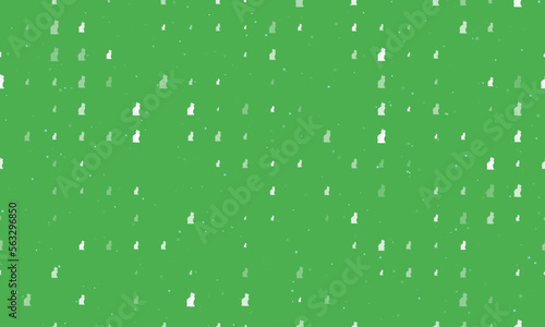 Seamless background pattern of evenly spaced white cat symbols of different sizes and opacity. Vector illustration on green background with stars