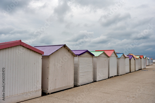 Row of pastel colored bathing huts at Le Treport beach, Normandy, France 