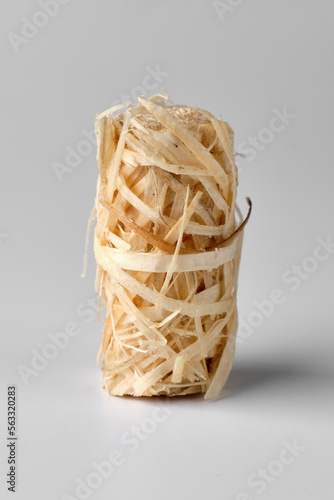 Wooden kindling roll isolated on white