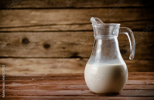 A jug of fresh milk on the table. 