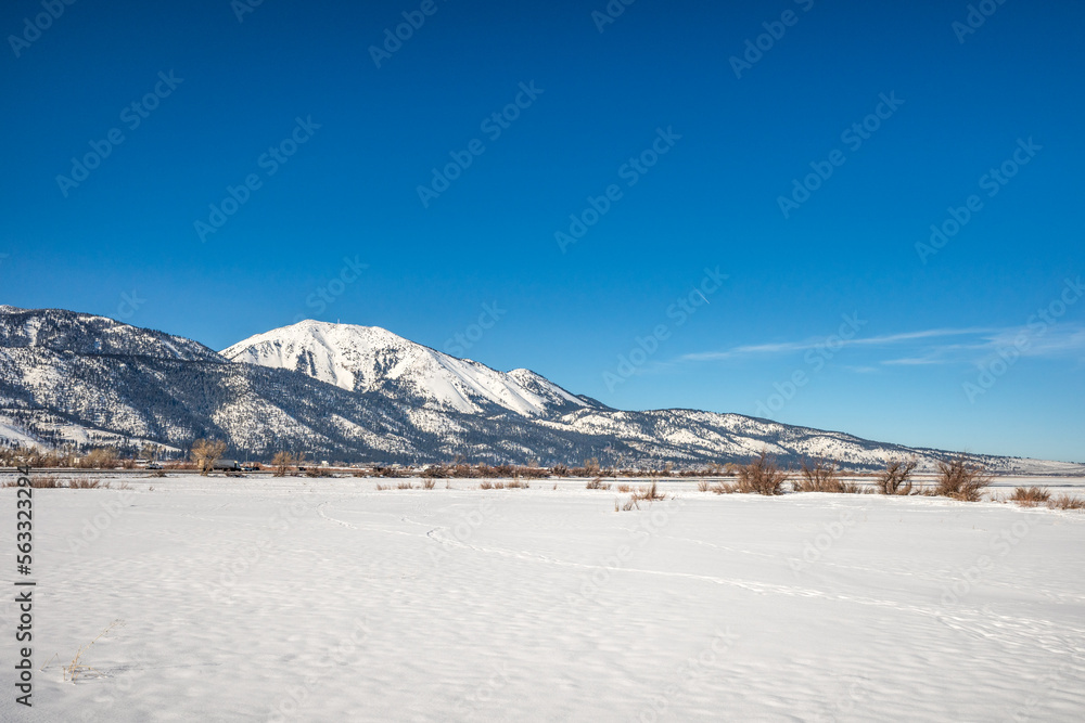 Snow covered frozen landscape with Mt Rose and Slide Mountain, in Washoe Valley between Reno and Carson City Nevada.