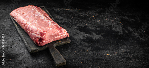 Raw pork on a cutting board. 